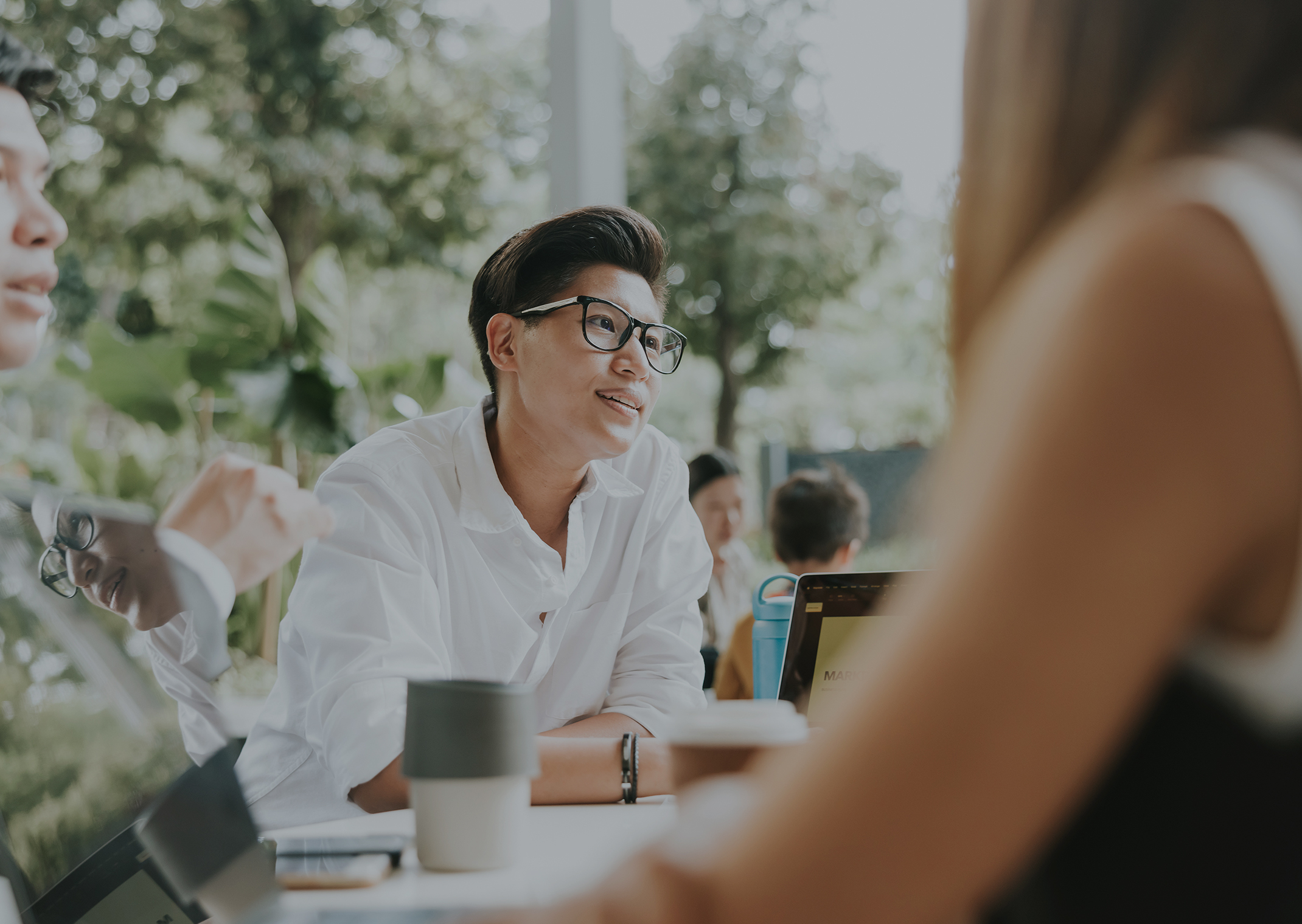 people seated at a table outdoors