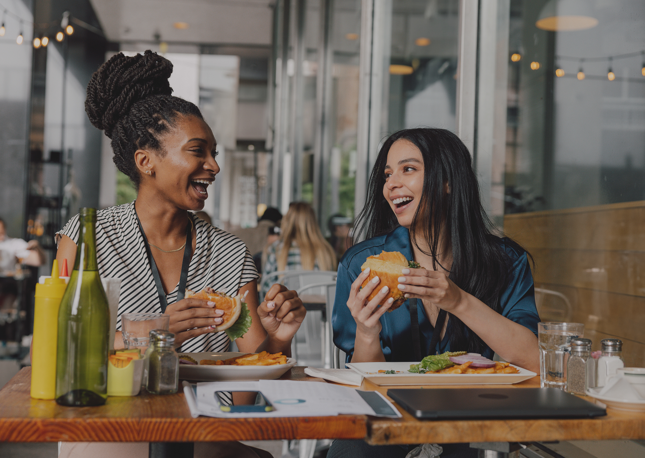Women seated at table eating
